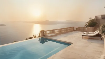 A sunlit hotel terrace and pool overlooking the Aegean Sea